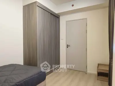 Modern bedroom with sleek wardrobe and minimalist design