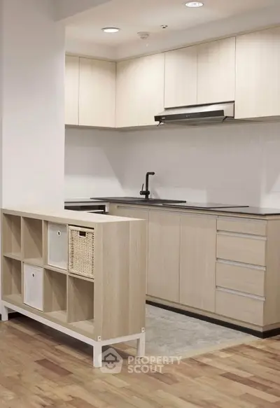 Modern kitchen with sleek cabinetry and open layout design
