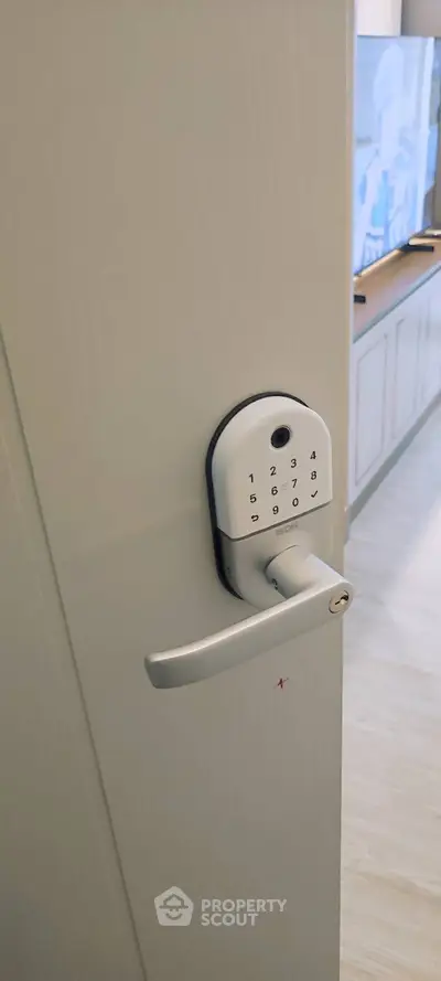 Modern smart lock on interior door in stylish living room