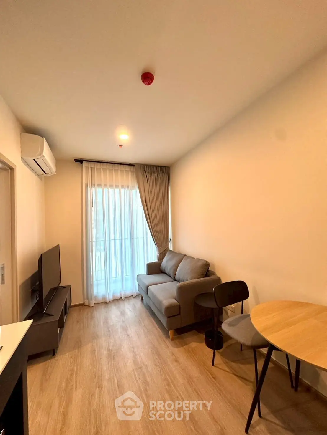 Cozy modern living room with natural light and stylish furniture