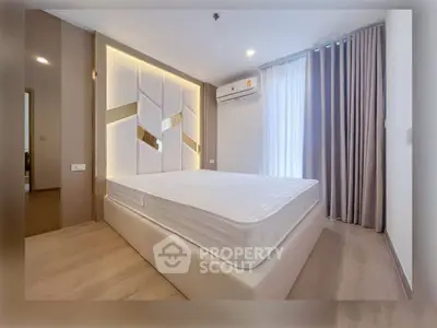 Modern bedroom with stylish wall design and natural light