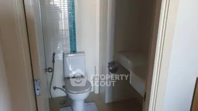 Compact bathroom with modern fixtures and sleek design