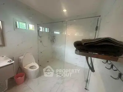Modern bathroom with glass shower and sleek fixtures