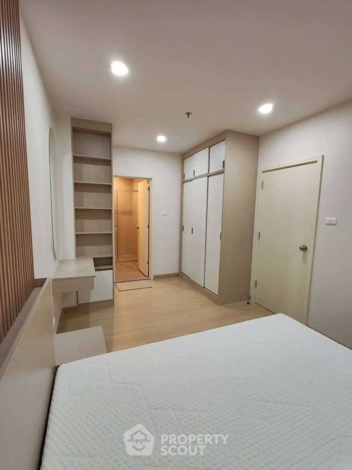 Modern bedroom with built-in wardrobe and sleek design