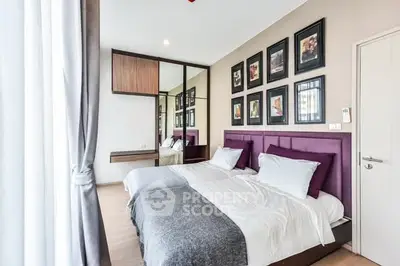 Modern bedroom with twin beds and stylish decor in a bright apartment.