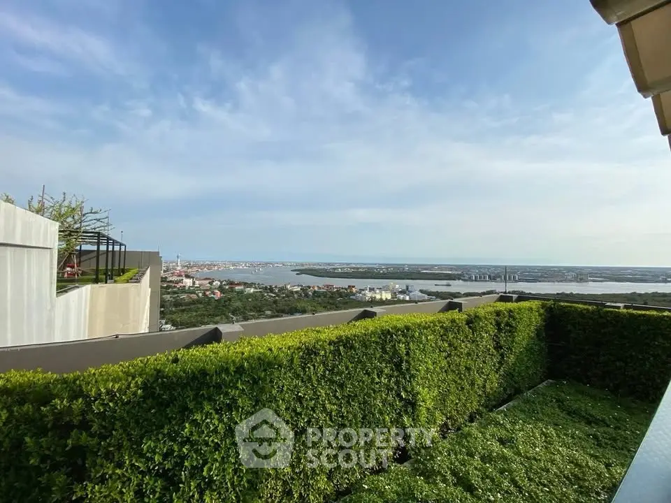 Stunning rooftop garden with panoramic river view, perfect for relaxation and entertainment.