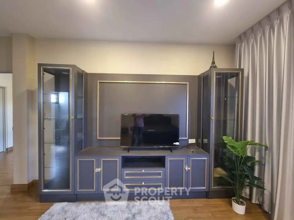 Elegant living room with modern entertainment center and stylish decor