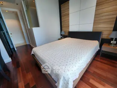 Modern bedroom with wooden flooring and stylish decor