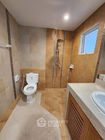 Modern bathroom with walk-in shower and stylish tile design