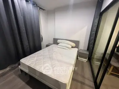 Modern bedroom with sleek design and ample natural light, featuring a comfortable bed and stylish decor.