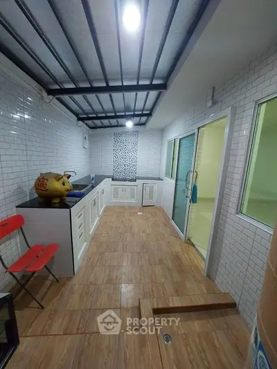 Spacious kitchen with modern design and wooden flooring