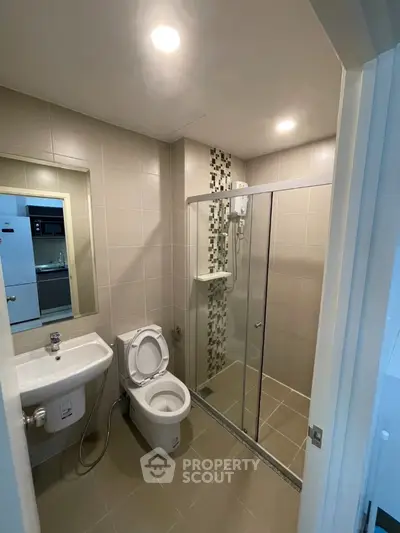 Modern bathroom with glass shower and sleek tile design