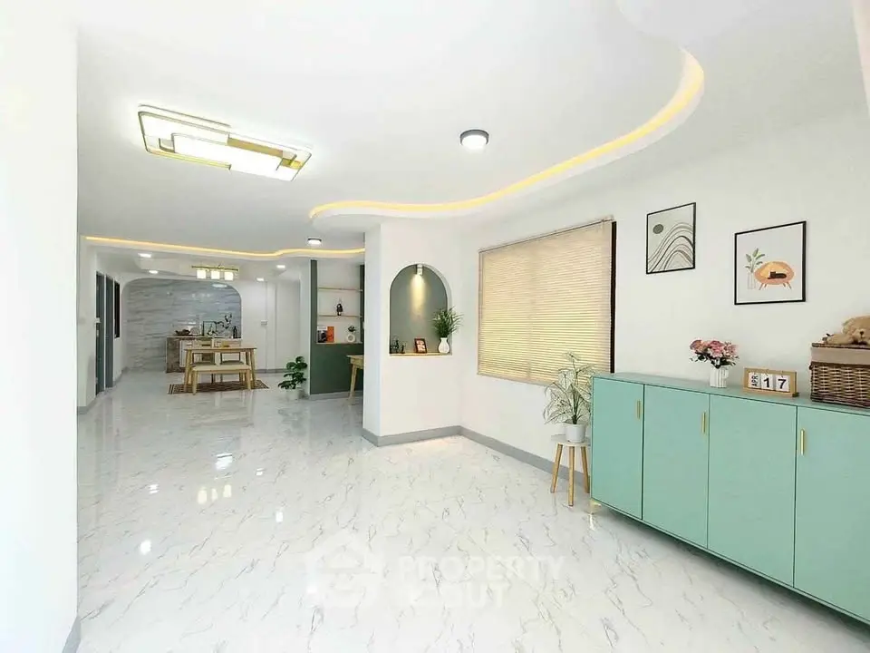 Spacious modern living area with elegant decor and ample natural light