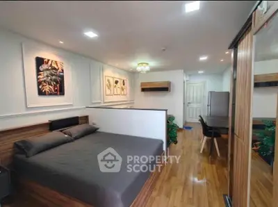 Modern studio apartment with stylish decor and wooden flooring