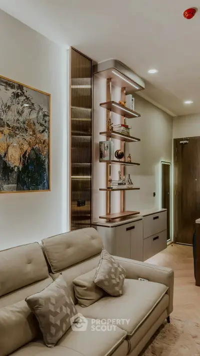 Modern living room with stylish shelving and cozy beige sofa