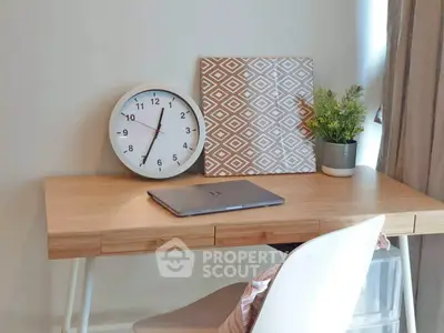 Modern study area with wooden desk, clock, and decor plant for a cozy home office.