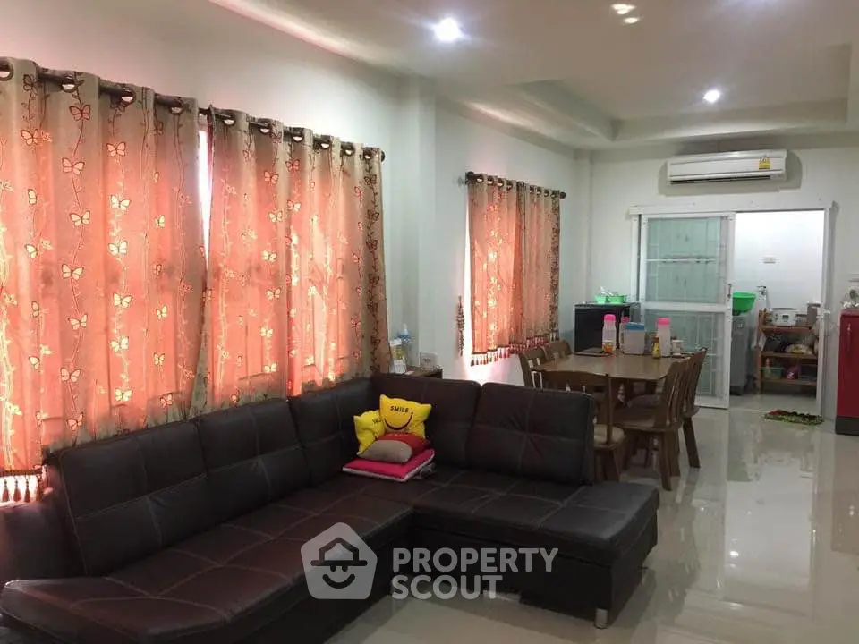 Spacious living room with modern furniture and dining area in open layout