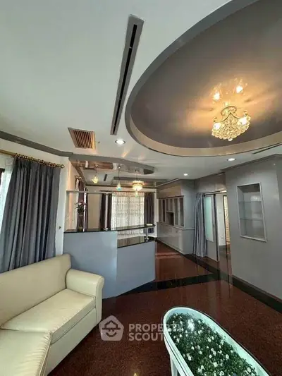 Luxurious living room with elegant ceiling design and modern lighting