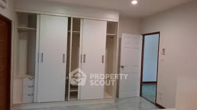 Spacious bedroom with built-in wardrobe and modern design