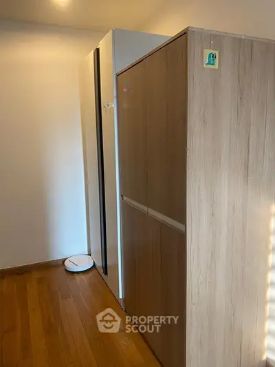 Modern storage space with wooden cabinets and sleek design