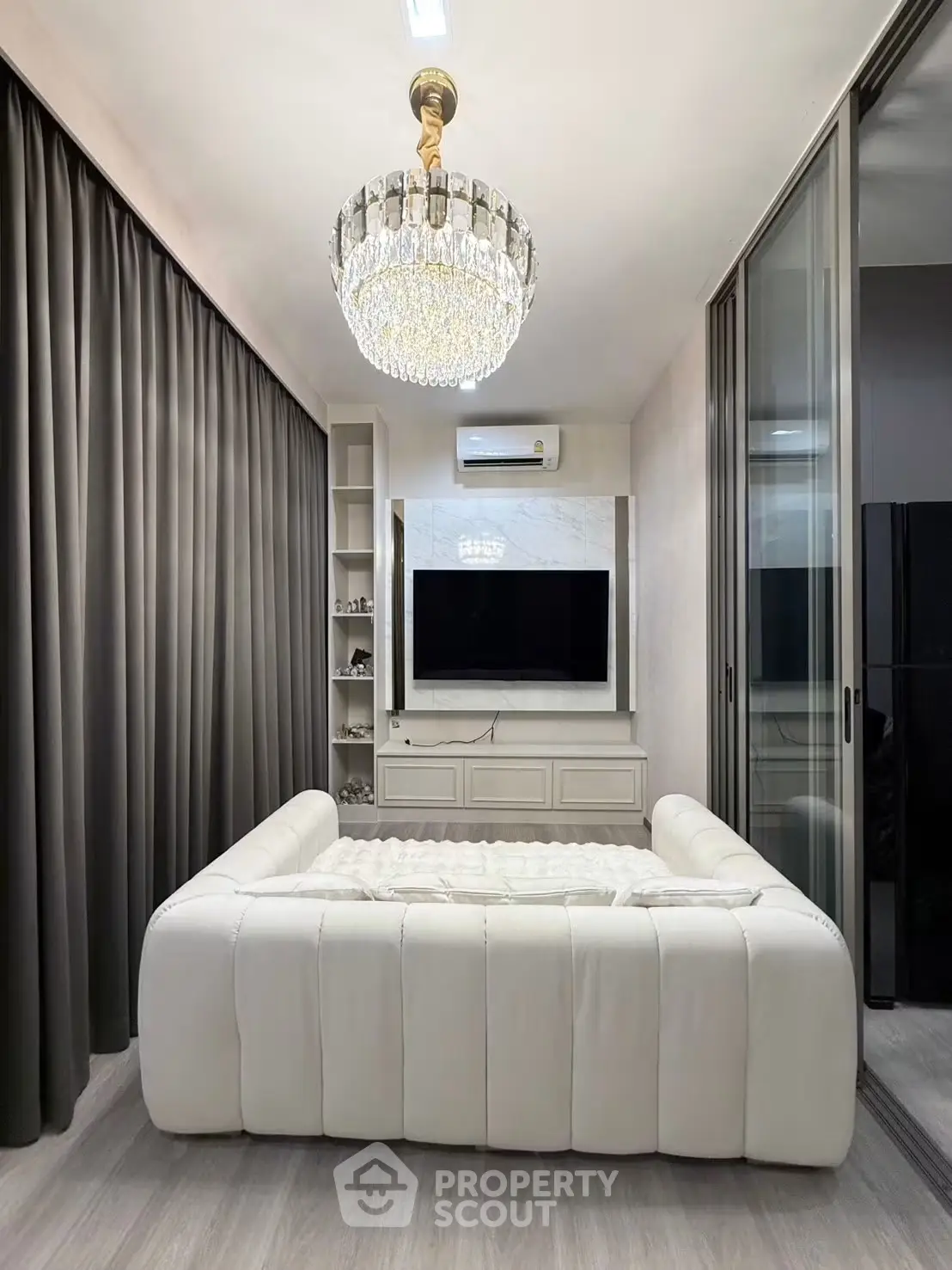 Luxurious living room with elegant chandelier and modern decor
