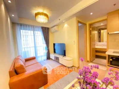 Modern living room with elegant chandelier and cozy leather sofa