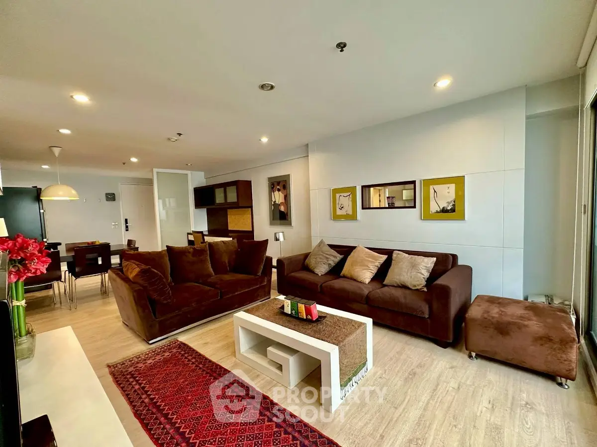Spacious modern living room with elegant decor and cozy seating area.