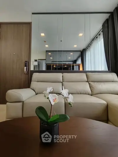 Modern living room with beige sofa and elegant decor