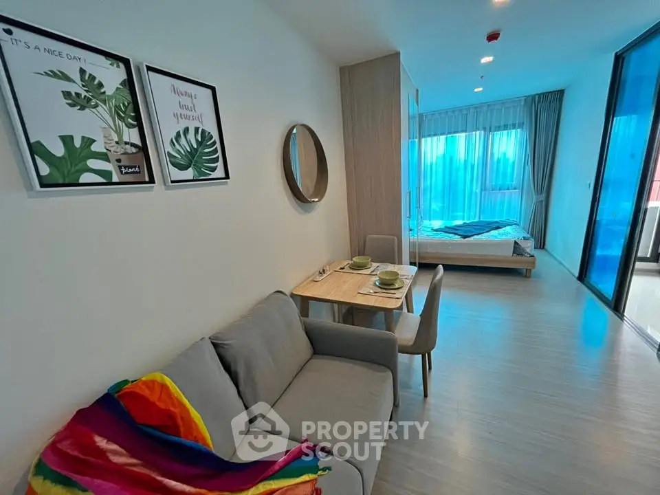 Modern studio apartment with cozy living area and stylish decor