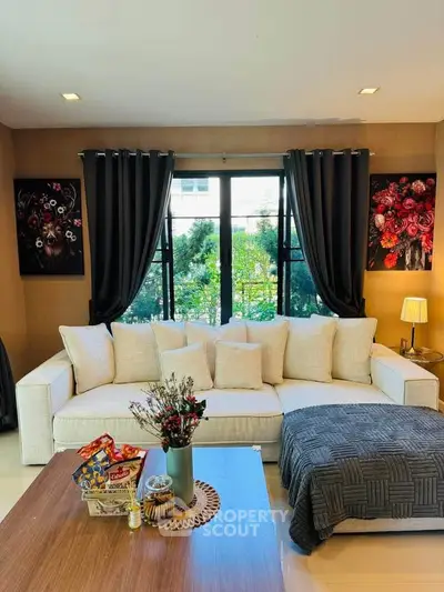 Stylish living room with elegant decor and cozy sofa, perfect for relaxation.