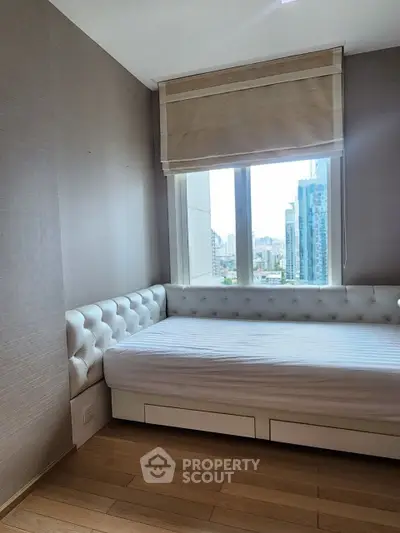 Modern bedroom with city view and stylish decor in urban apartment