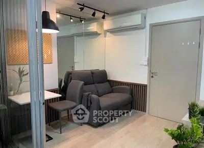 Cozy small living room with modern decor and air conditioning