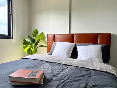 Cozy bedroom with stylish headboard and natural light