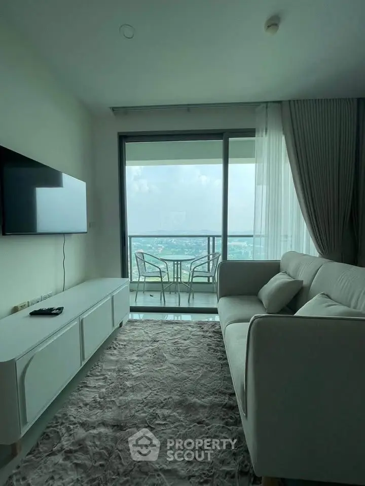 Modern living room with stunning balcony view and elegant decor