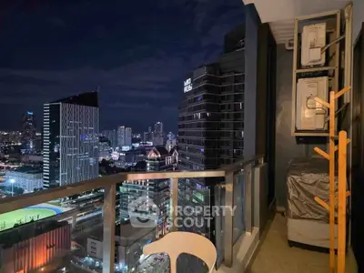 Stunning cityscape view from a modern high-rise balcony at night, perfect for urban living.