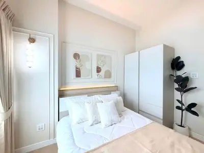 Bright and modern bedroom with stylish decor and ample natural light.
