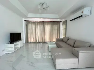Spacious modern living room with elegant sofa and natural light