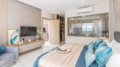 Luxurious bedroom with modern decor and large window for natural light