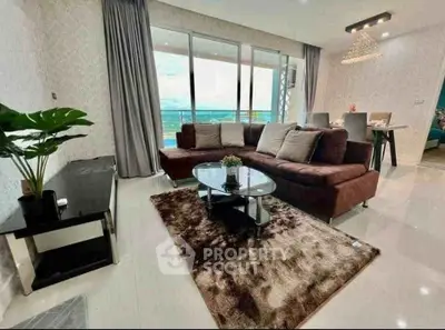 Luxurious living room with plush sofa and stunning balcony view in modern apartment.