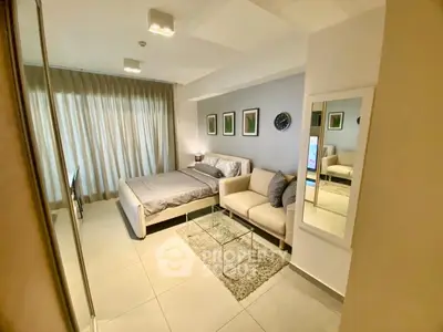Modern bedroom with stylish decor and cozy seating area, perfect for relaxation and comfort.