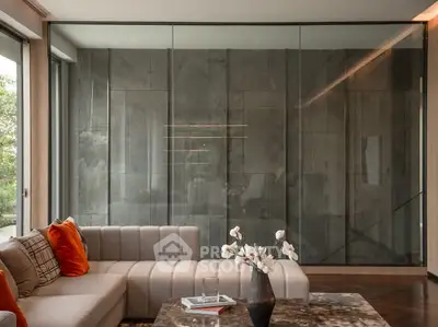 Luxurious modern living room with elegant decor and large glass wall