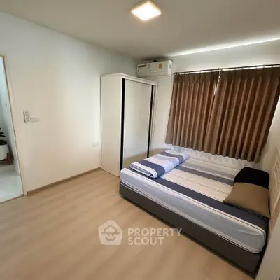 Modern bedroom with minimalist design and ample natural light