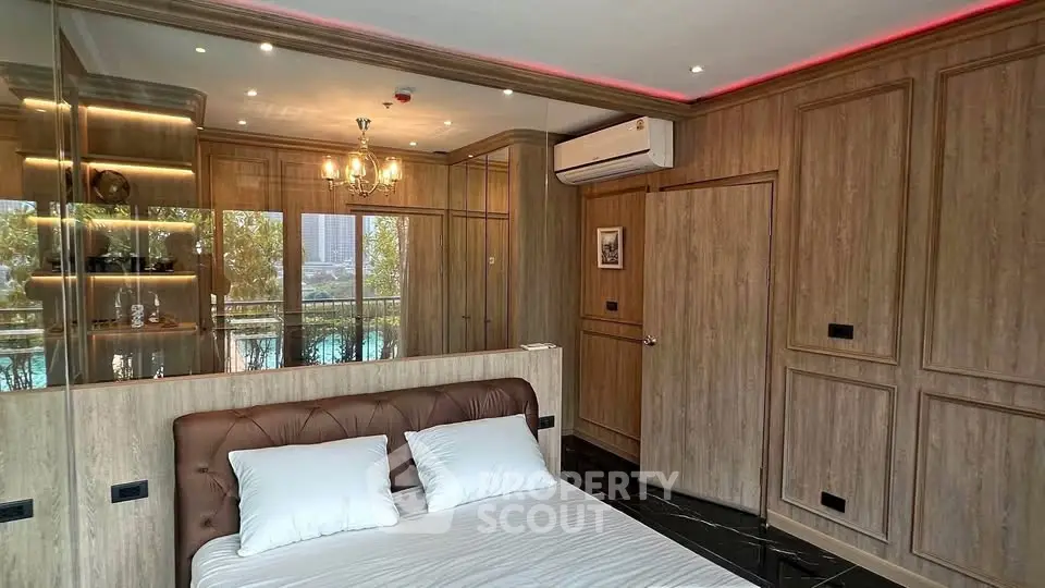 Luxurious bedroom with elegant wood paneling and balcony view