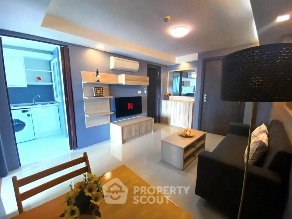 Modern living room with open kitchen and stylish decor