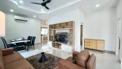 Spacious modern living room with elegant furniture and open kitchen layout