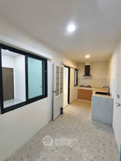 Modern kitchen with closed layout and gas stove in a compact apartment