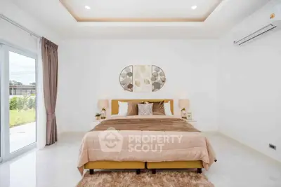 Luxurious bedroom with elegant decor and large window for natural light