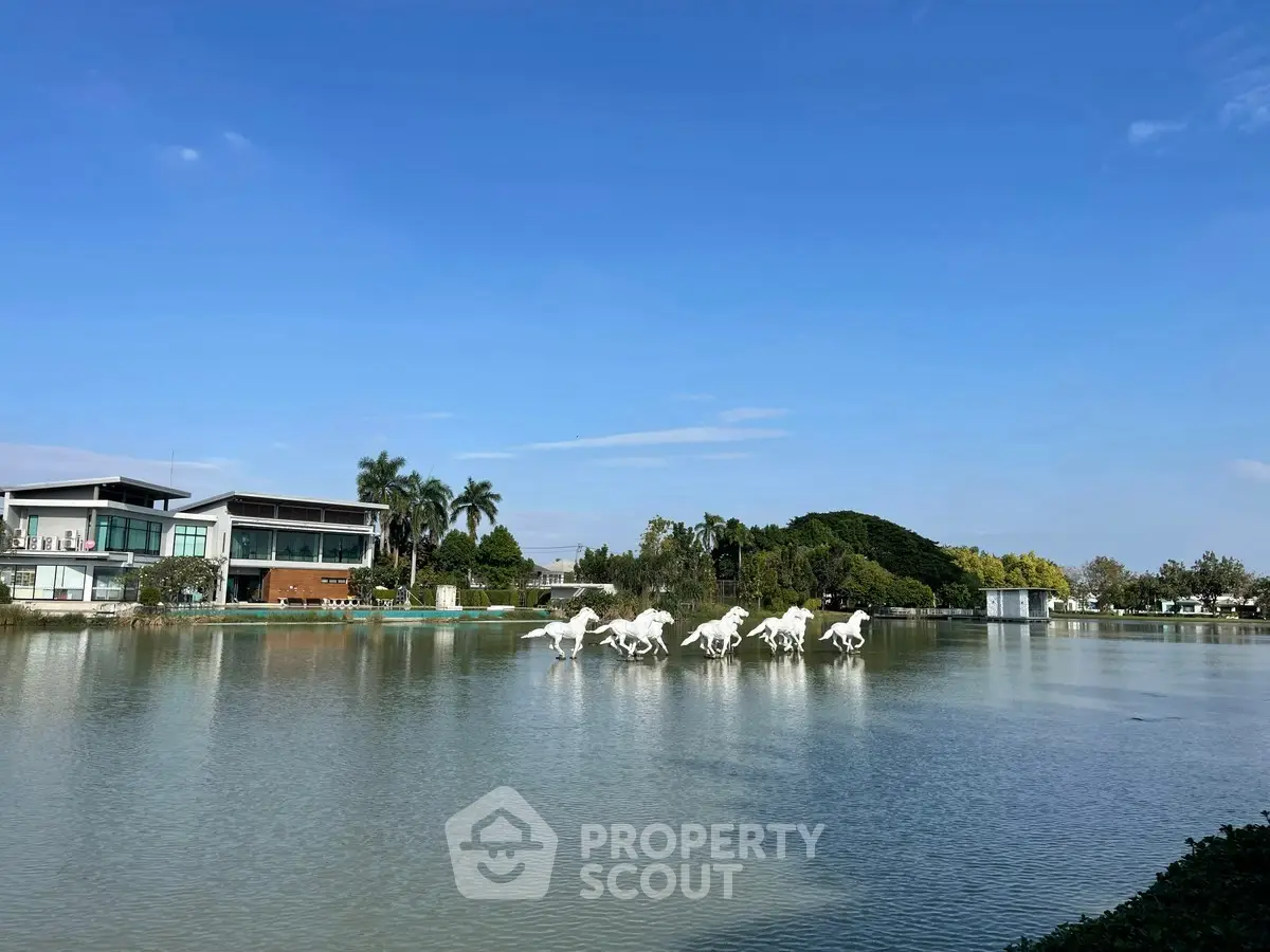 Luxurious waterfront property with stunning lake view and modern architecture, perfect for serene living.