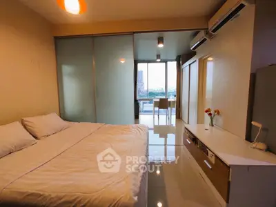 Modern bedroom with balcony view and sleek interior design
