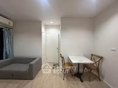 Modern living room with minimalist decor and cozy seating area